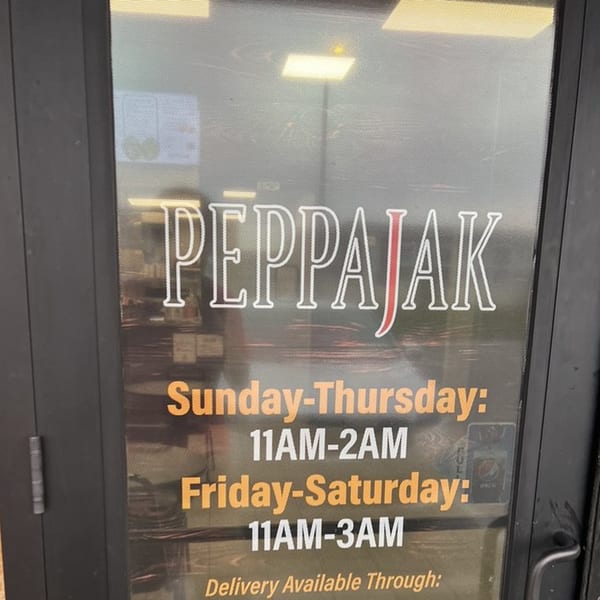 Peppajak restaurant door with hours of operation: Sunday-Thursday 11AM-2AM, Friday-Saturday 11AM-3AM.