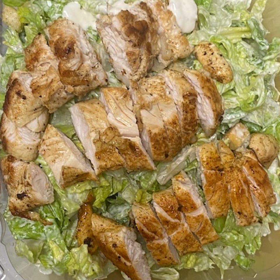 Peppajak's Caesar salad with grilled chicken, croutons, and creamy dressing.